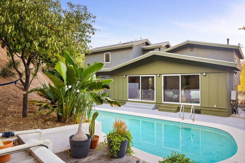 exterior of green house with pool