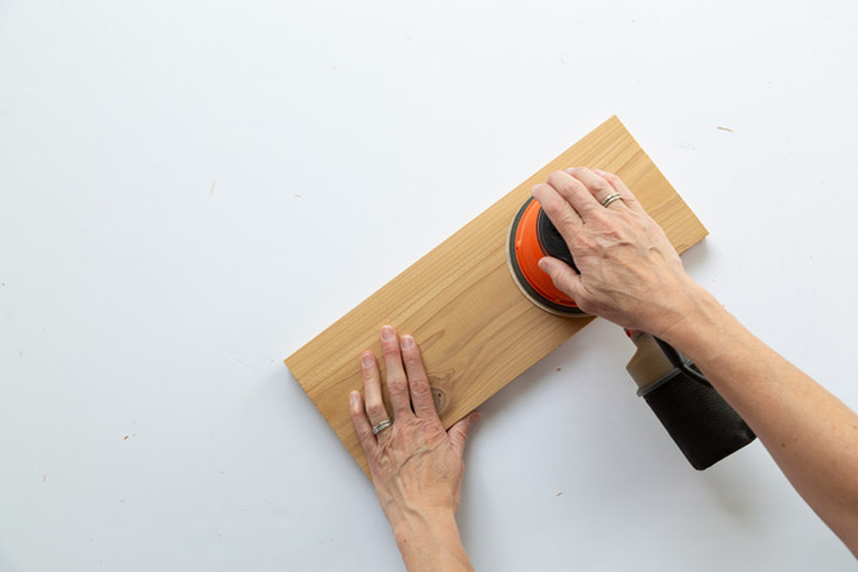 sanding wood for DIY House Number Planter