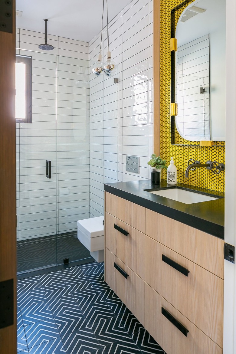 contemporary bathroom with yellow penny tile backsplash