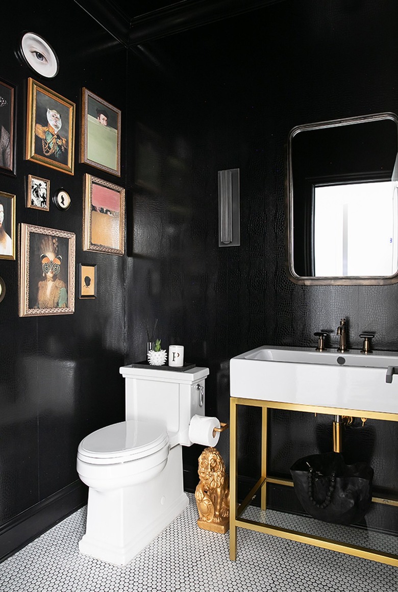 regency glam bathroom with black crocodile embossed wallpaper and white penny tile floor