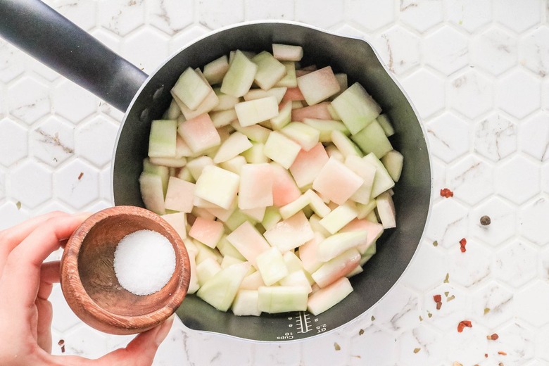 Toss watermelon rind with salt
