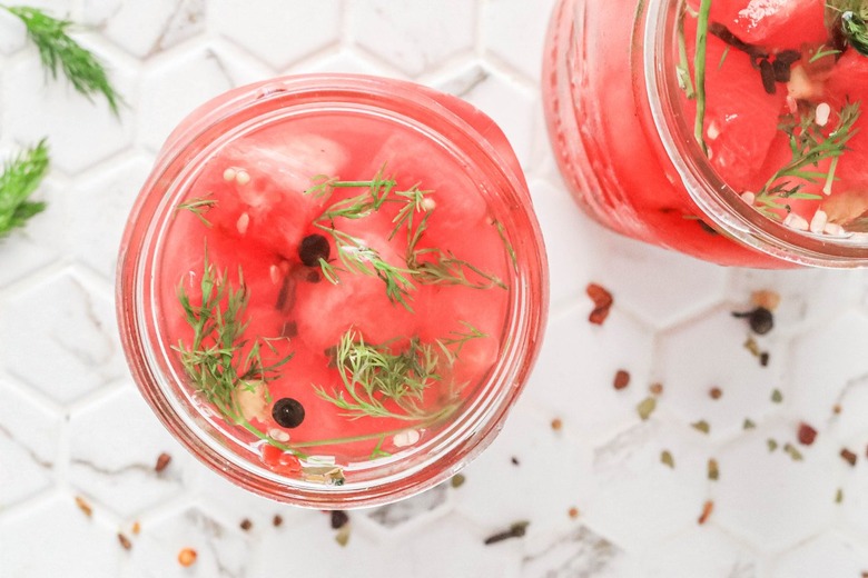 Pour brine into the jars