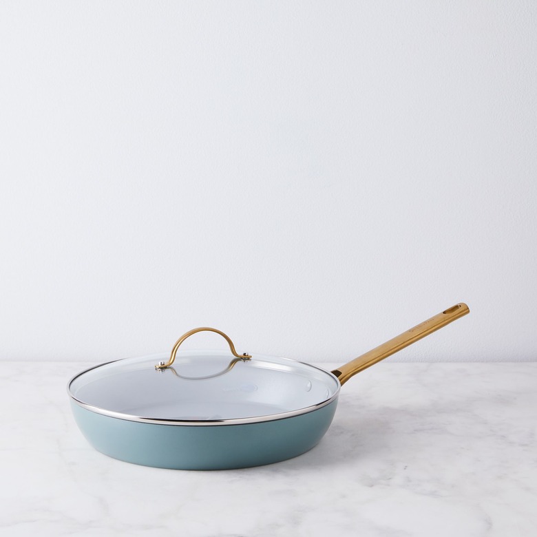 Blue ceramic nonstick cookware pan with brass handle and lid