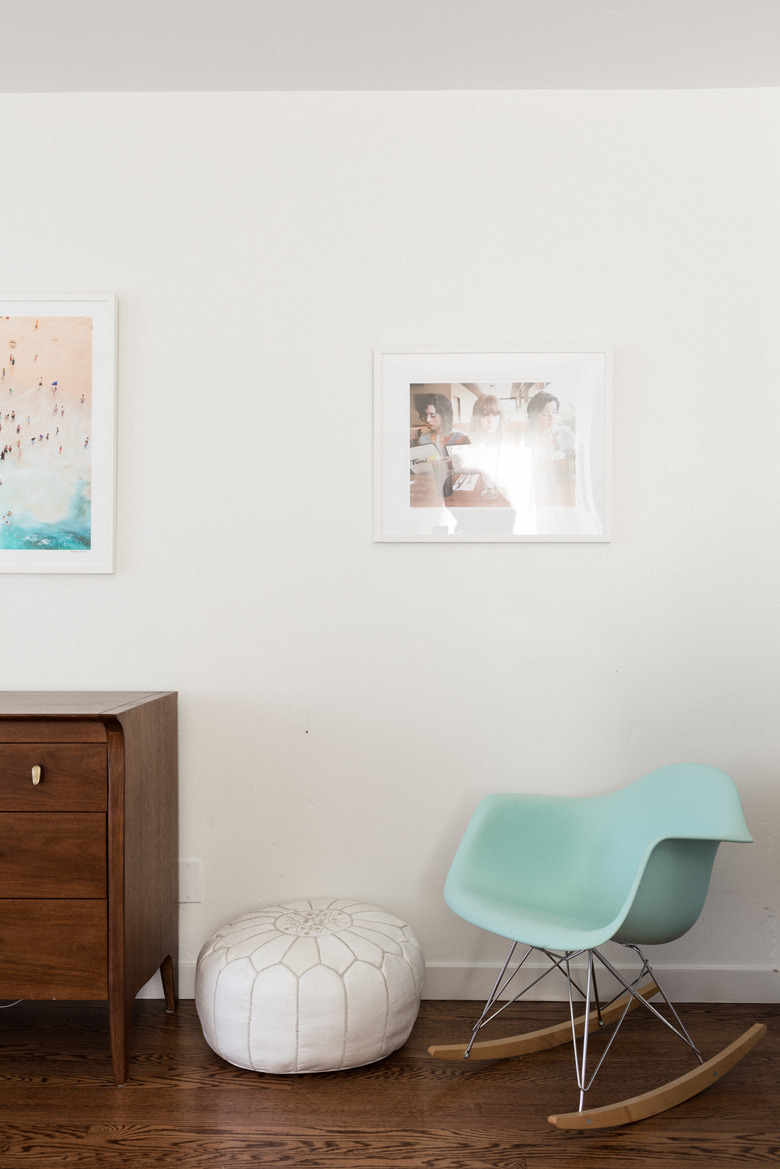 Dresser next two leather pouf and Eames rocking chair