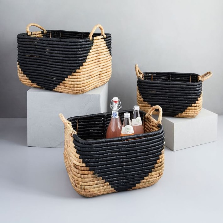 Black geometric storage containers in seagrass with handles