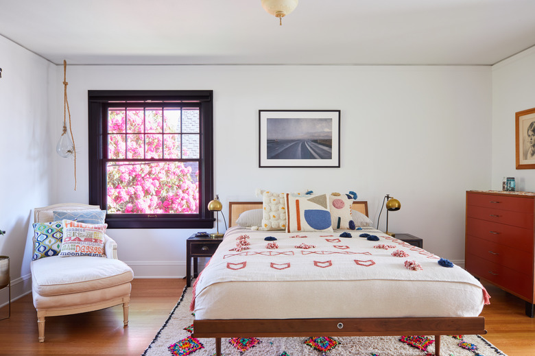 eclectic bedroom with white walls