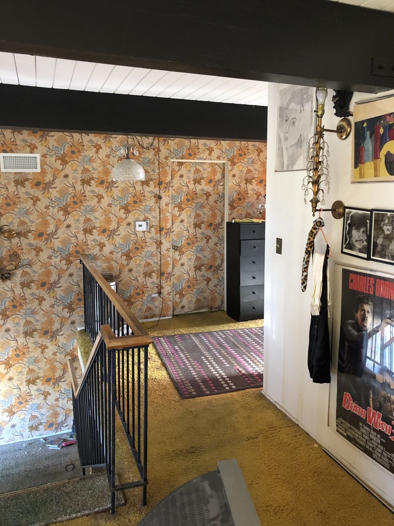 upper hallway with wallpaper
