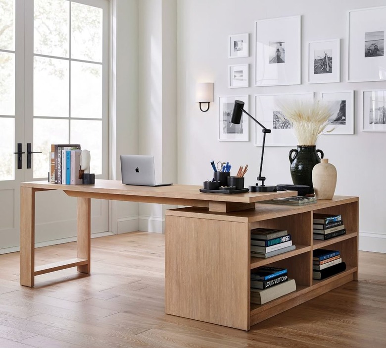 L-shaped desk topped with books