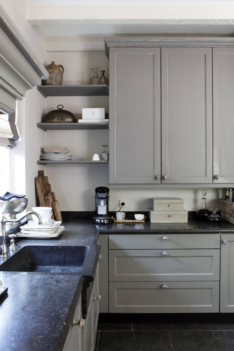 integrated sink in kitchen with quartz countertops and greige cabinets and open shelving