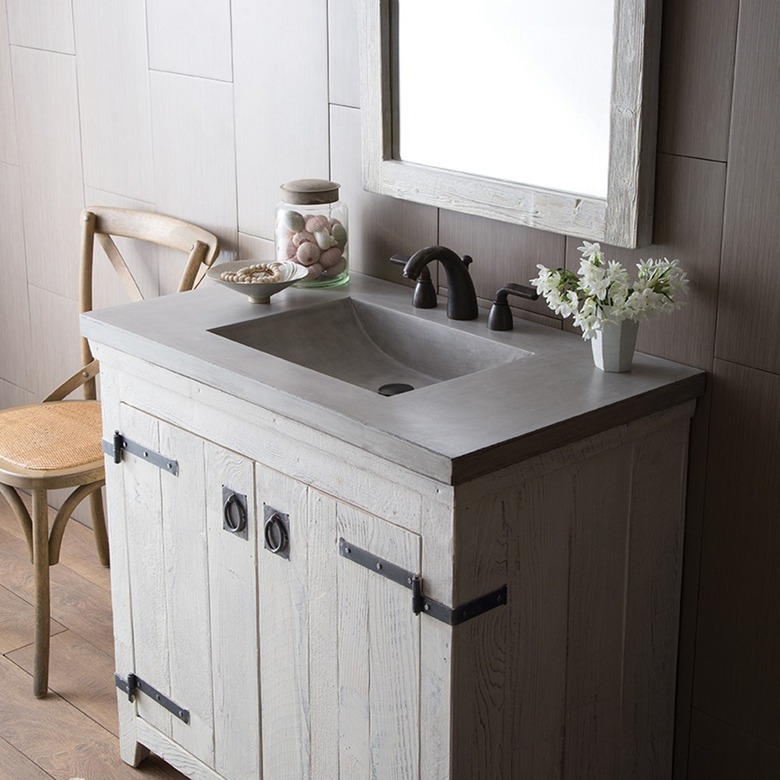 powder room with vanity with concrete integrated sink and countertop
