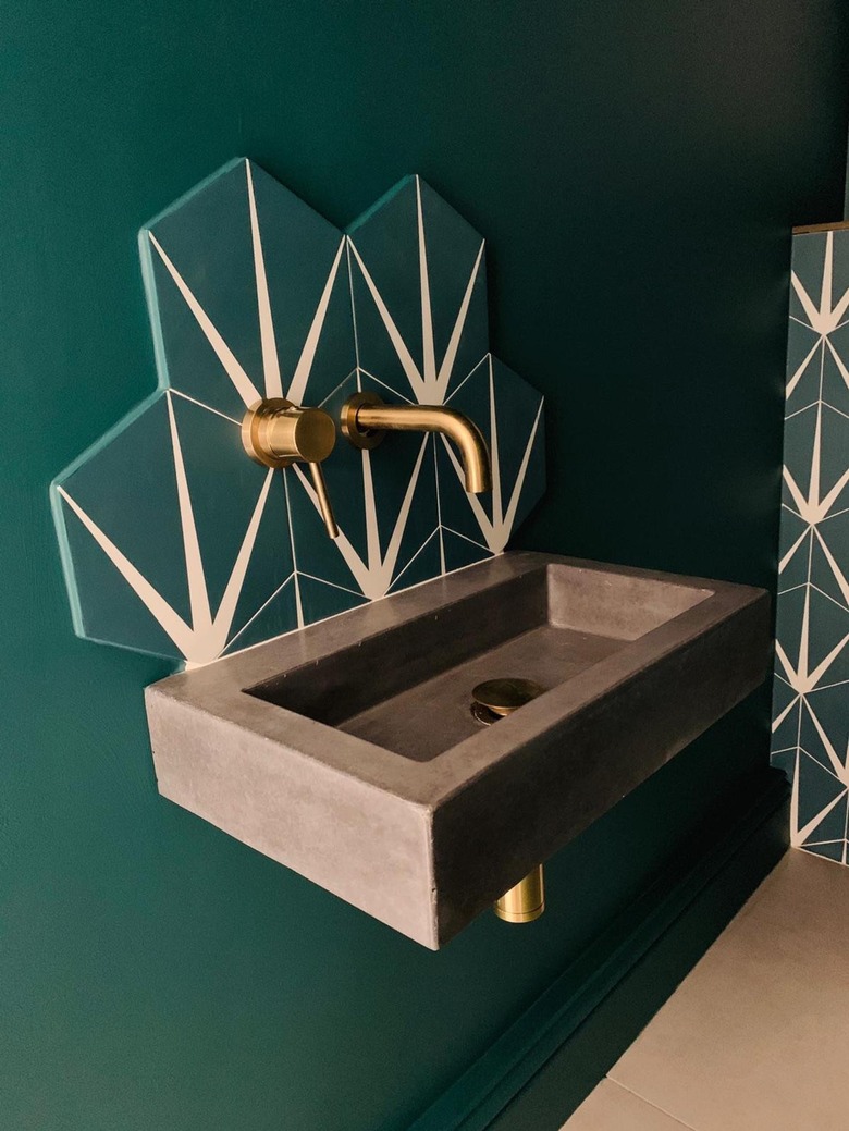 wall-mounted integrated sink in a green bathroom