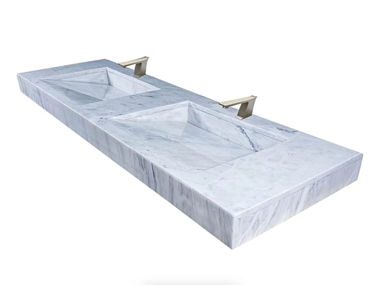 white marble vanity with double integrated sinks
