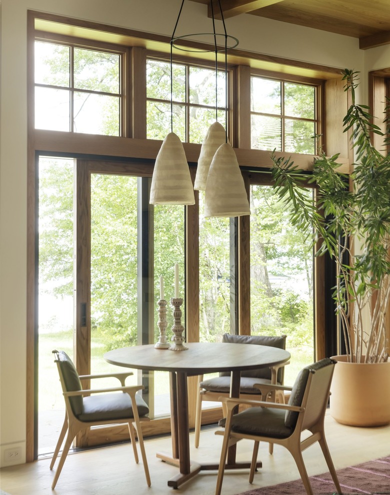 great room with game table and chairs in front of sliding glass doors