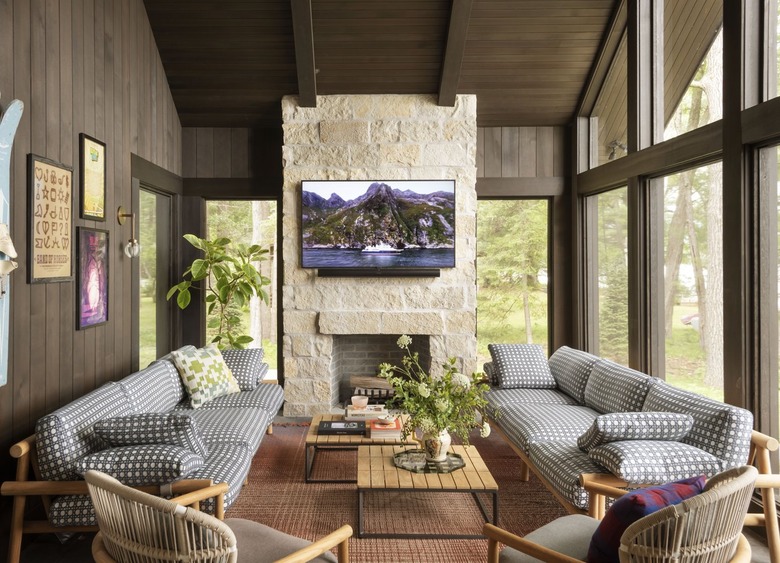 enclosed porch area with fireplace and seating