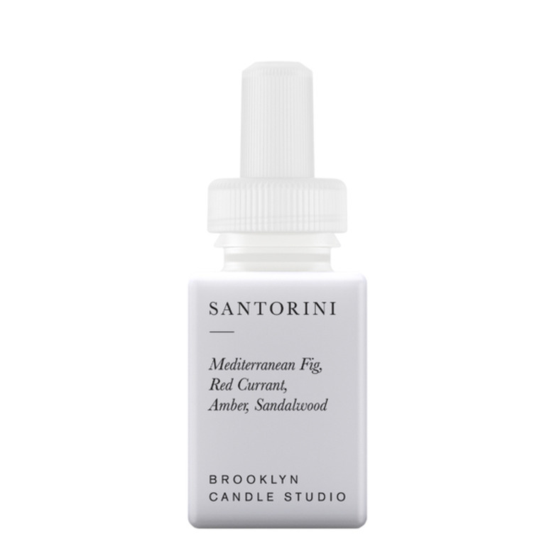 white essential oil bottle with black text