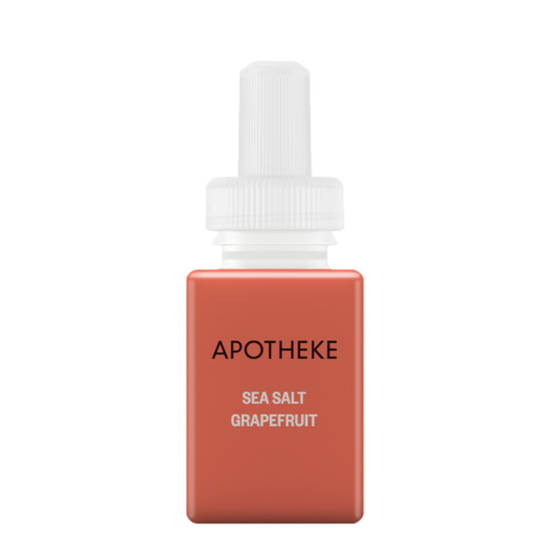 coral essential oil bottle with black and white text