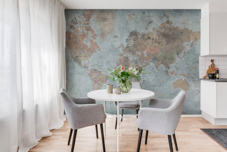 World map wallpaper with table and chairs