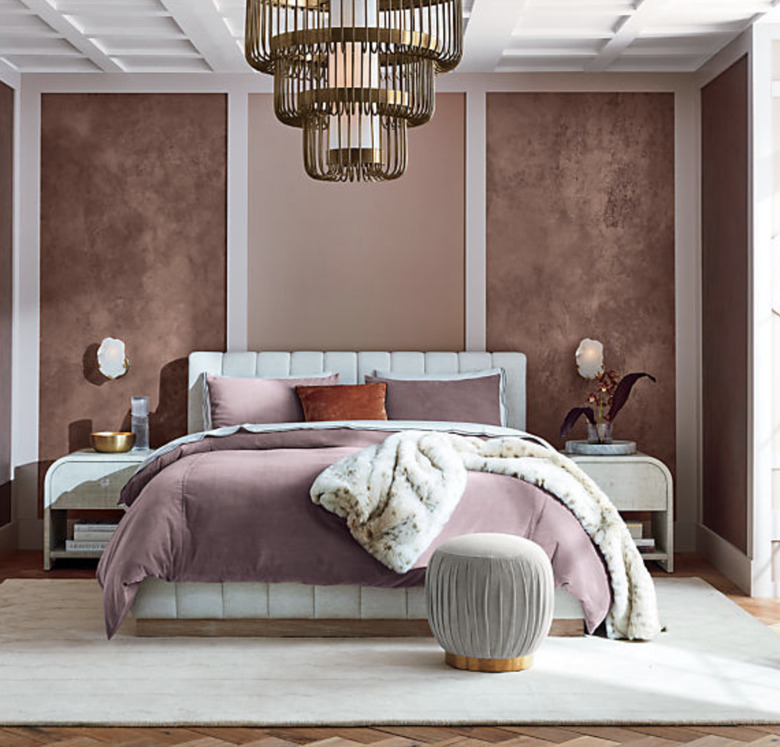 1920s bedroom with white upholstered bedframe