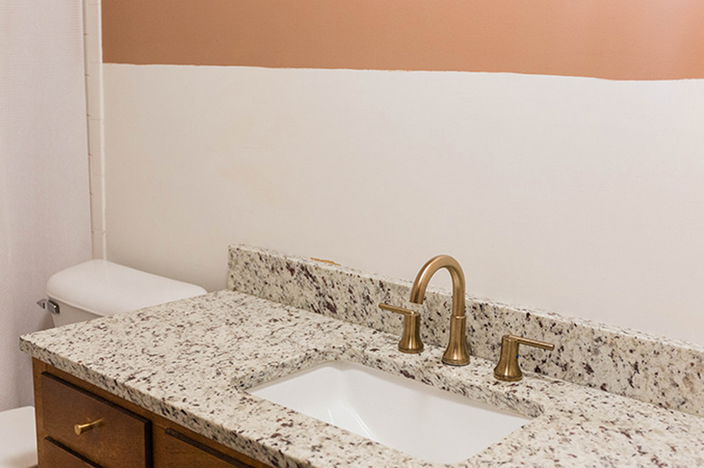 You should be left with an unblemished wall behind the wallpaper.