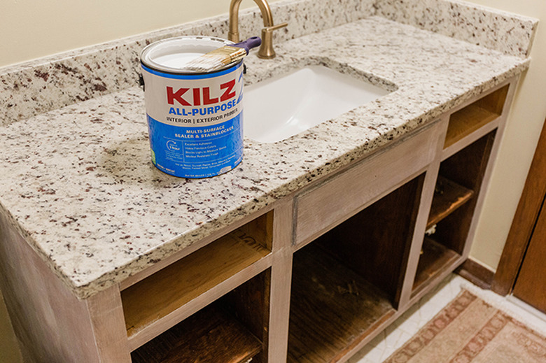 Prime the cabinet doors and surround.