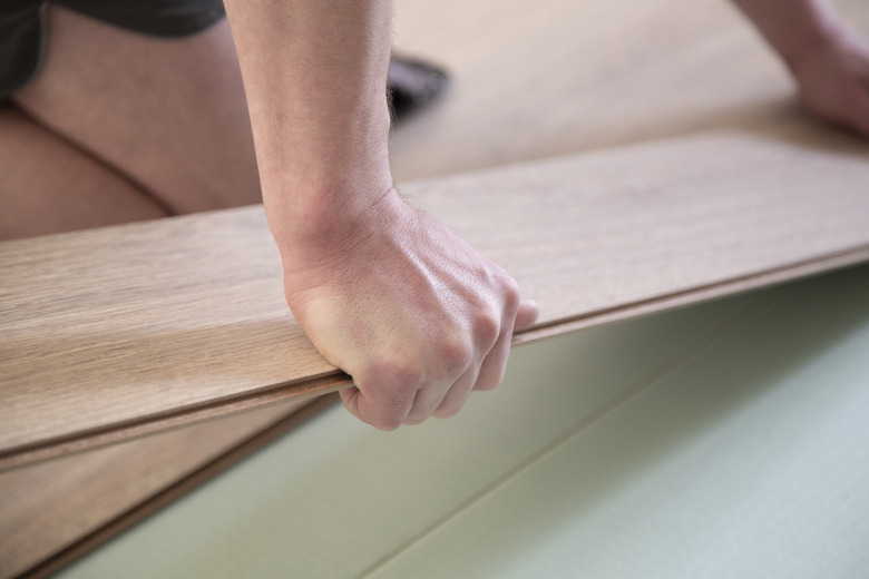 Installing laminate on the floor.