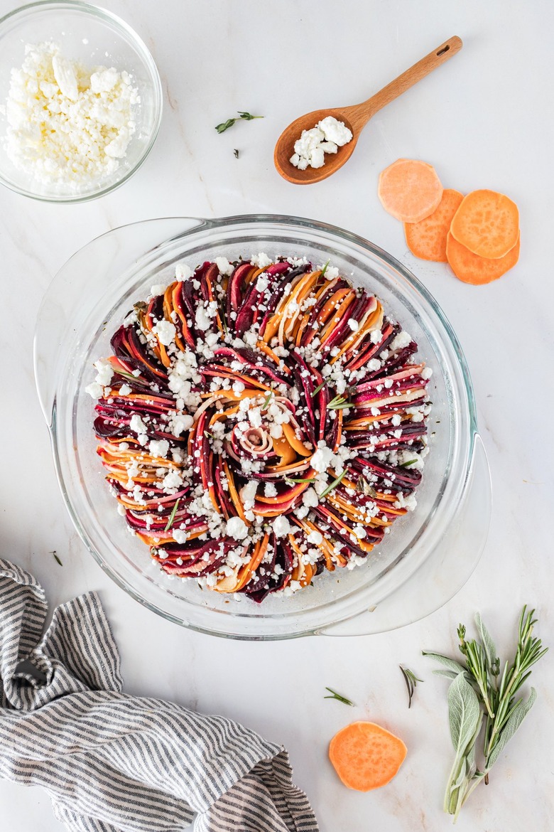 The spiraled vegetables in the glass dish topped with white goat cheese crumbles.