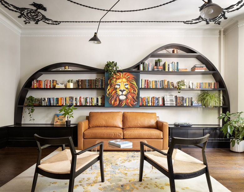 A modern living room with a leather brown couch