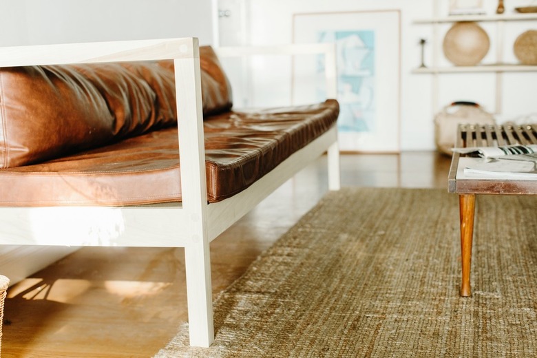 Leather couch in boho living room with coffee table