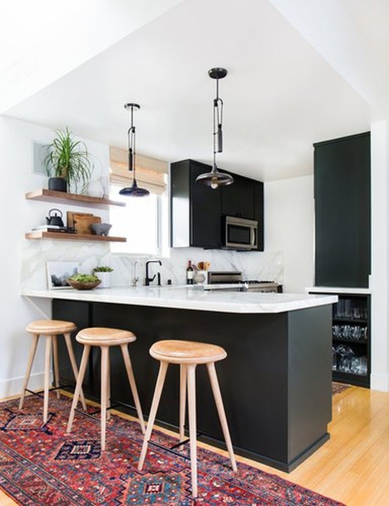 area rugs in the kitchen with black cabinets