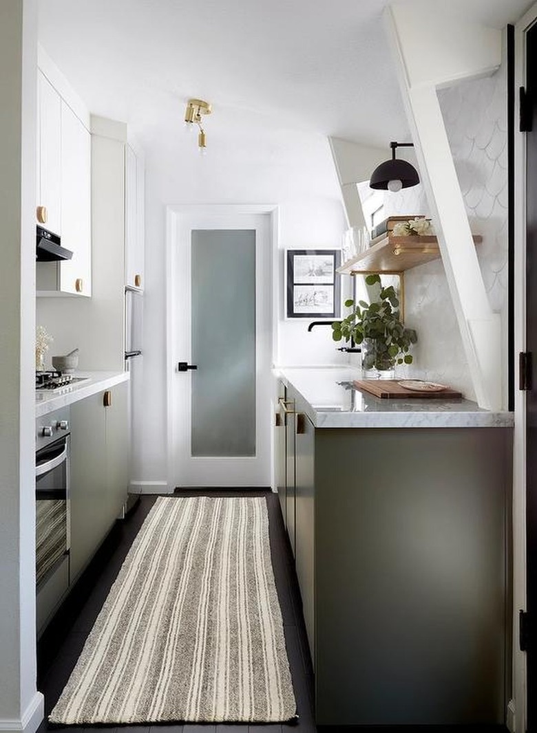 olive green kitchen with tan striped rug