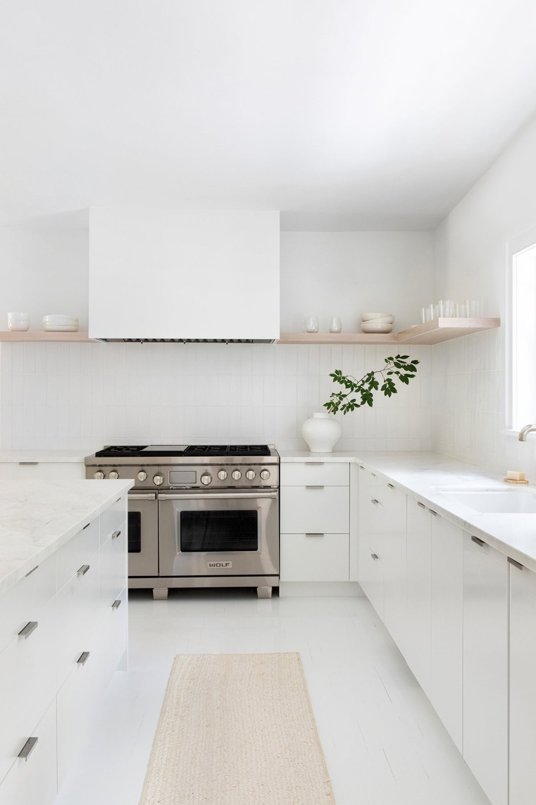all white kitchen with cream rug