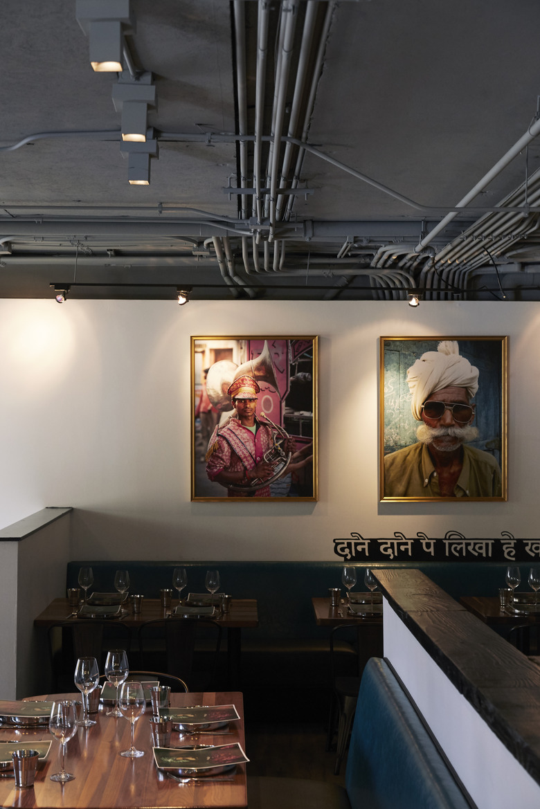 Dining room with portraits.