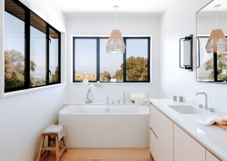 White bathroom with white tub