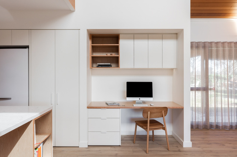 white Scandinavian home office that minimalist with cabinets and built-in desk