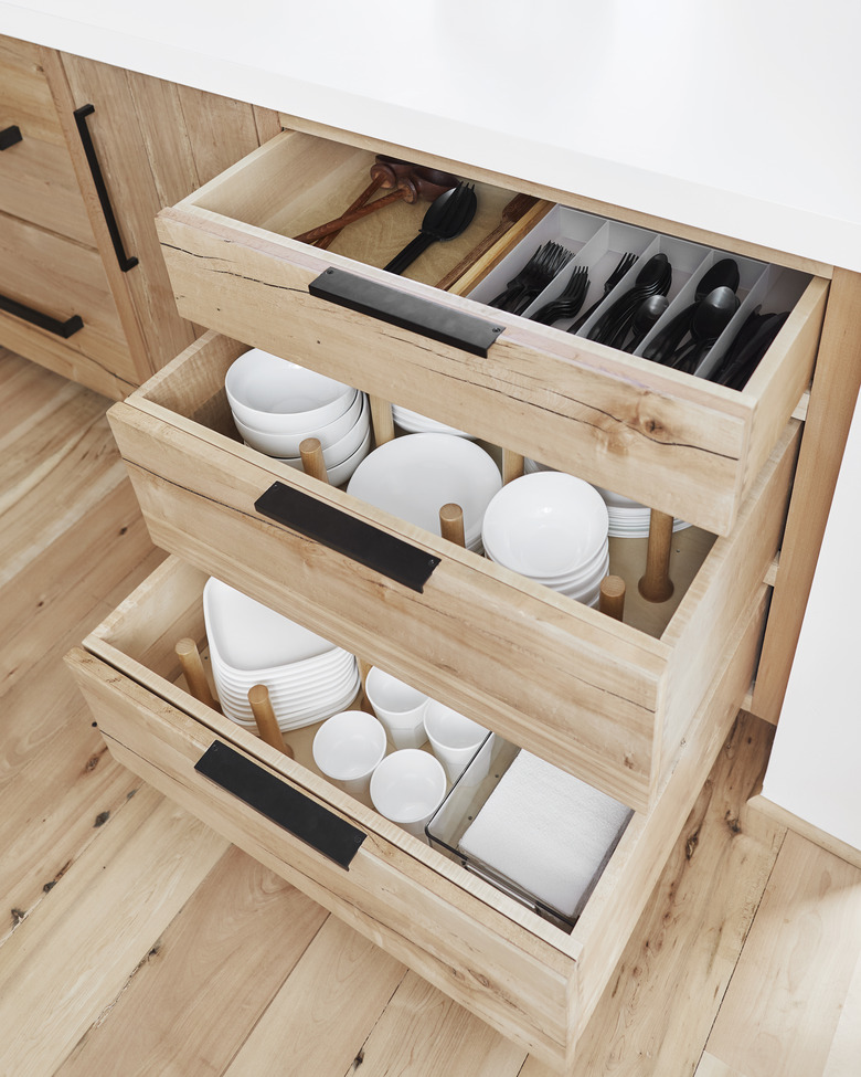 small kitchen organization idea with peg system dividing drawers
