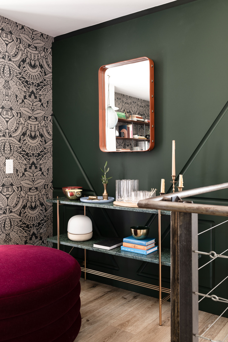Gubi TS console table in front of green accent wall