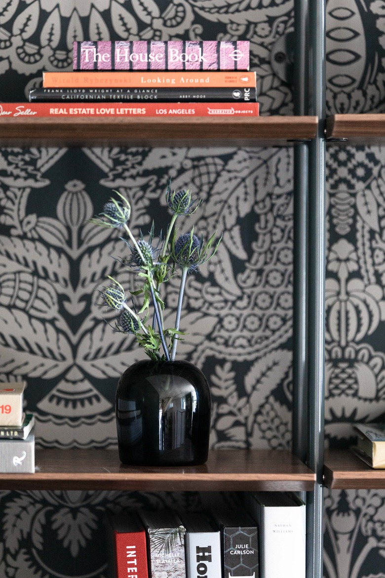 Menu Troll vase in smoke on bookcase shelf in front of patterned wallpaper
