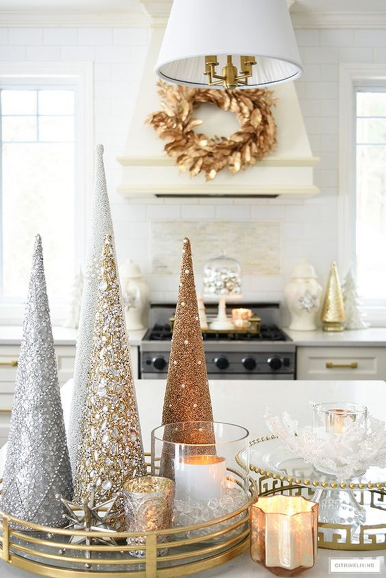 Cone-shaped tree ornaments on top of kitchen worktops