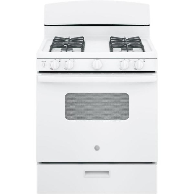 White small gas stove with grates and storage drawer