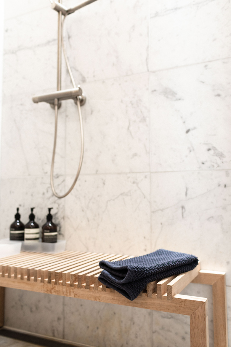 small modern bathroom with in-shower seating