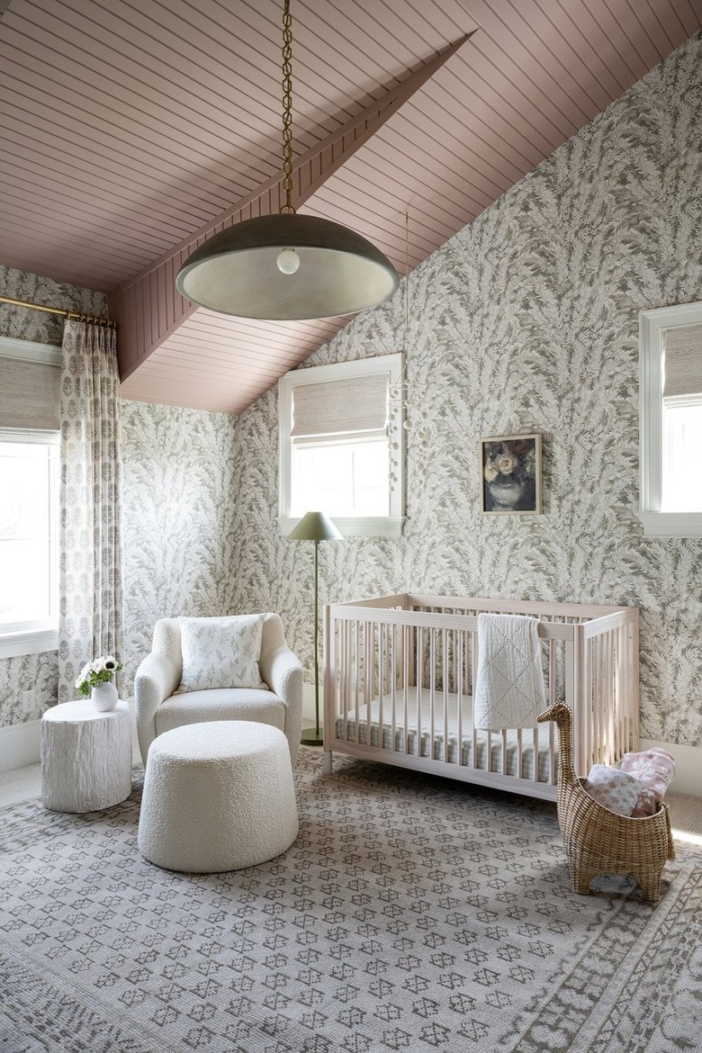 Nursery with stylish wallpaper