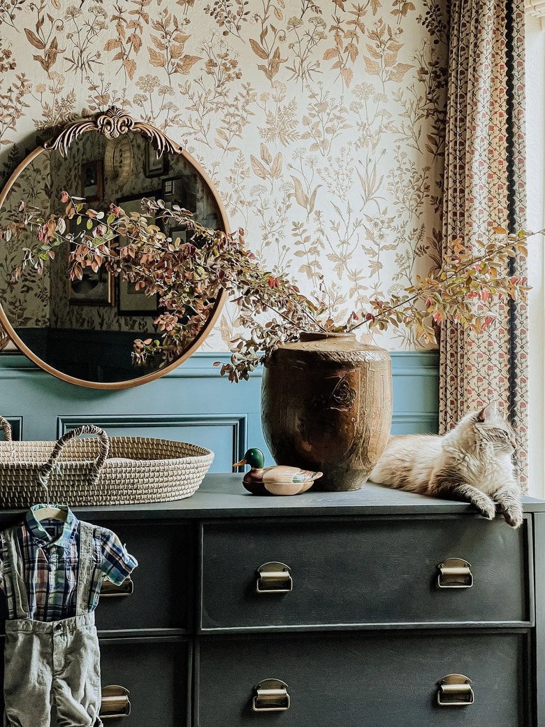 Nursery with whimsical wallpaper