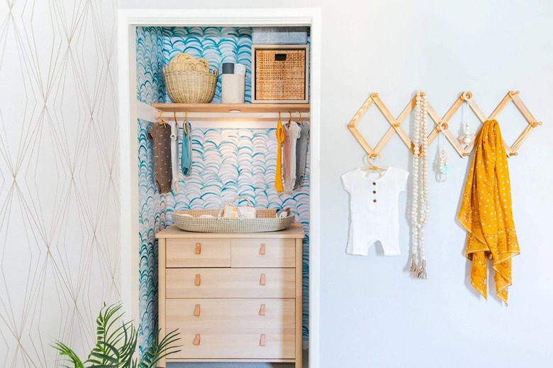 Nursery designed by Jasmine Roth utilizing a closet without doors