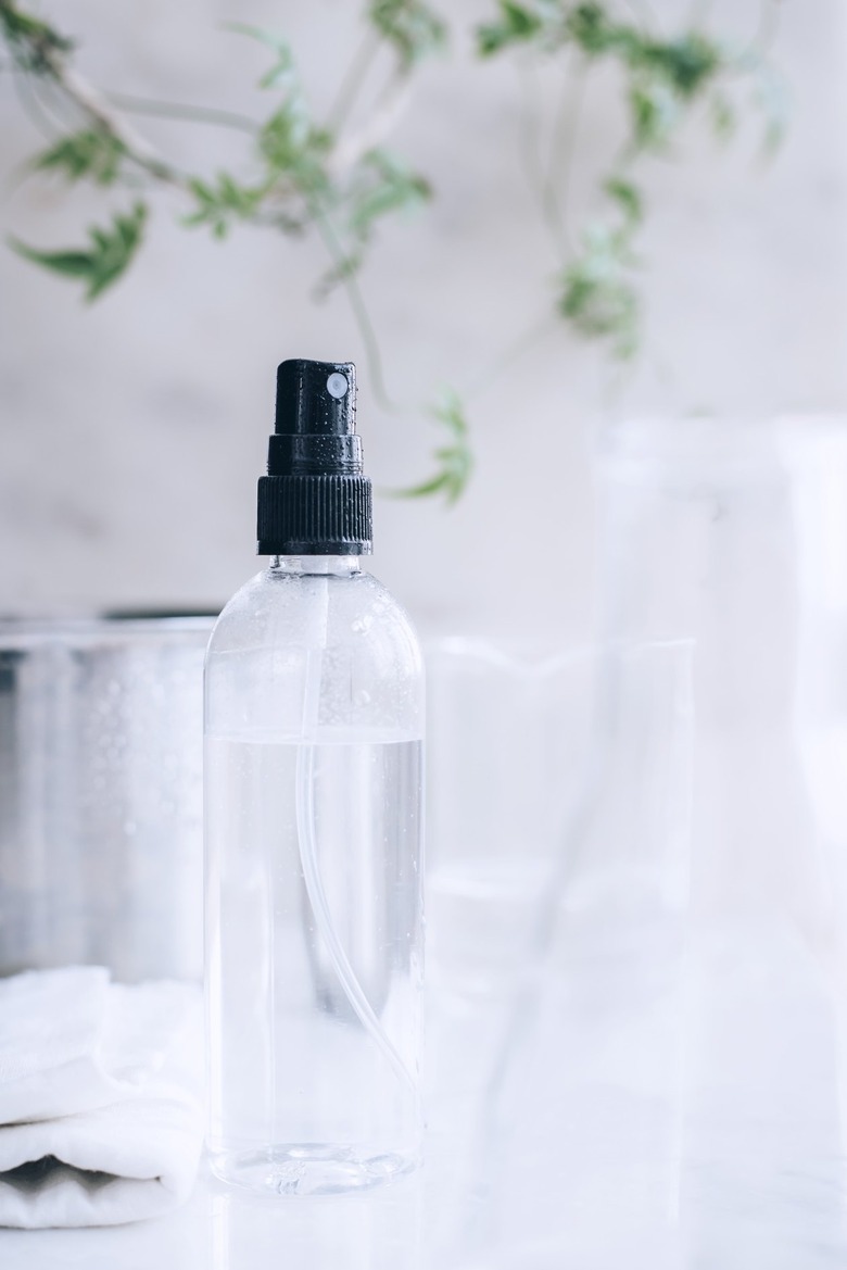 a small spray bottle full of vinegar