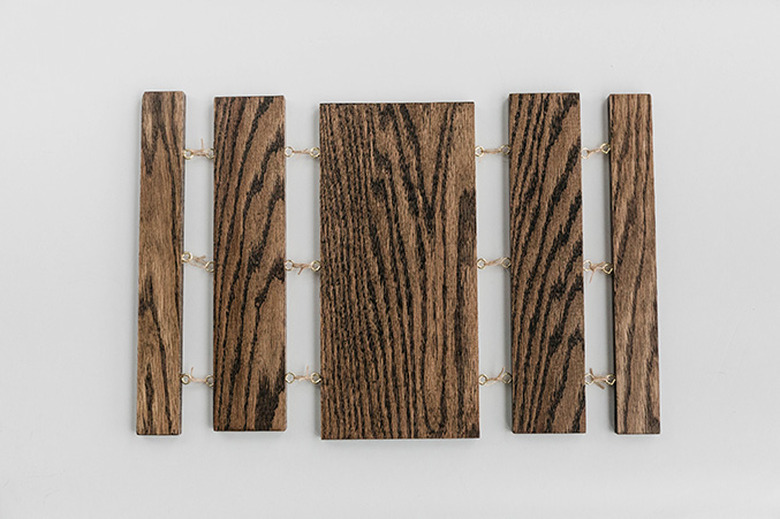 Tie string in between to attach the boards together.