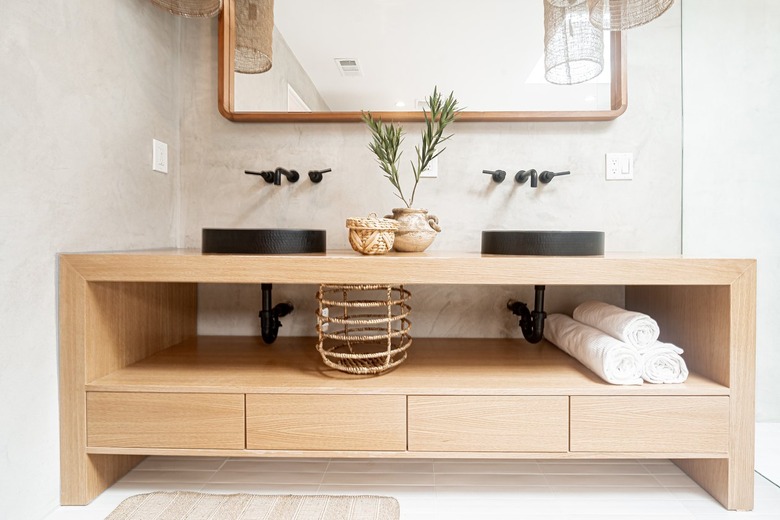 Light wood bathroom vanity with towels