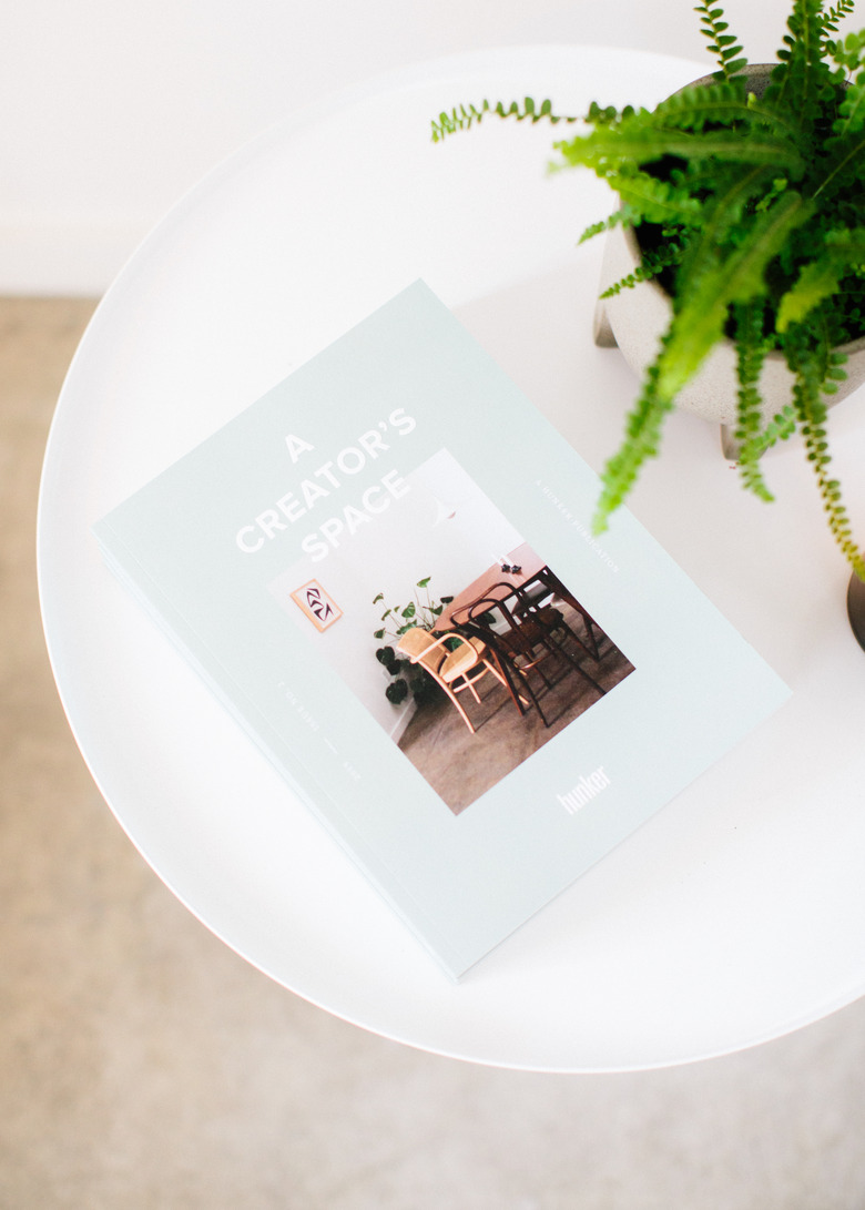 Coffee table with book and plant