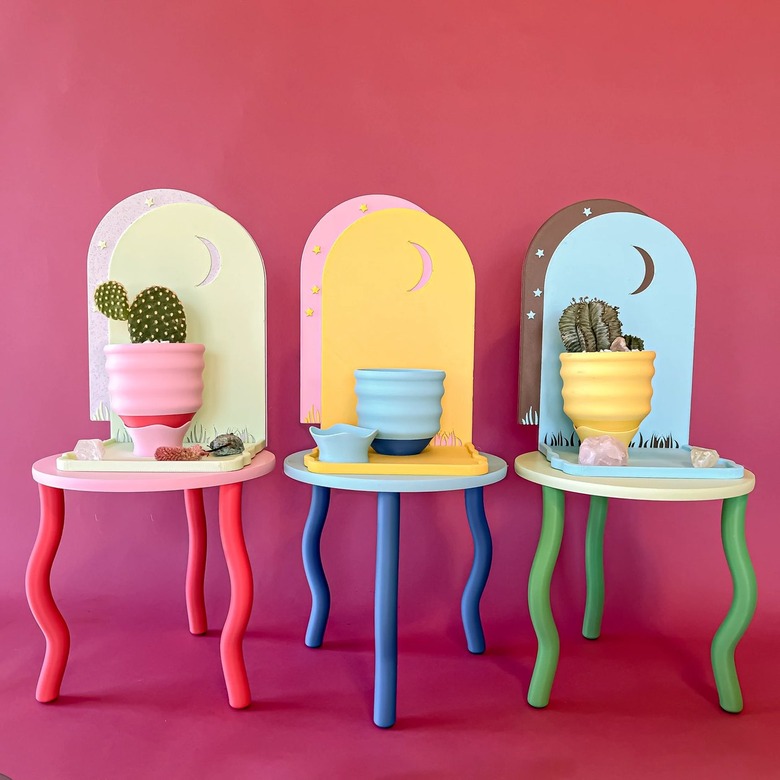 Three of Object Lover's wavy plant stands in pink
