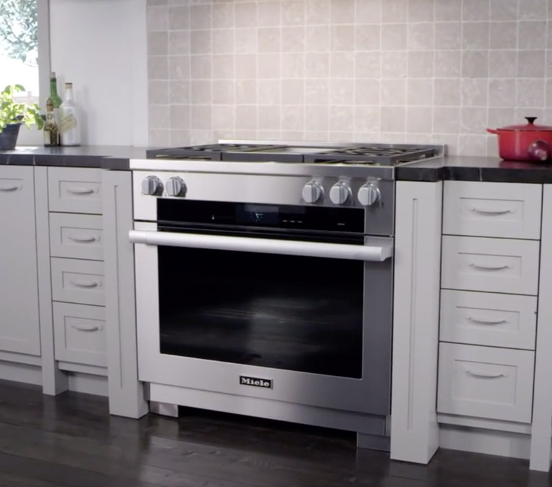Stainless Steel Gas Stove in kitchen with red dutch oven