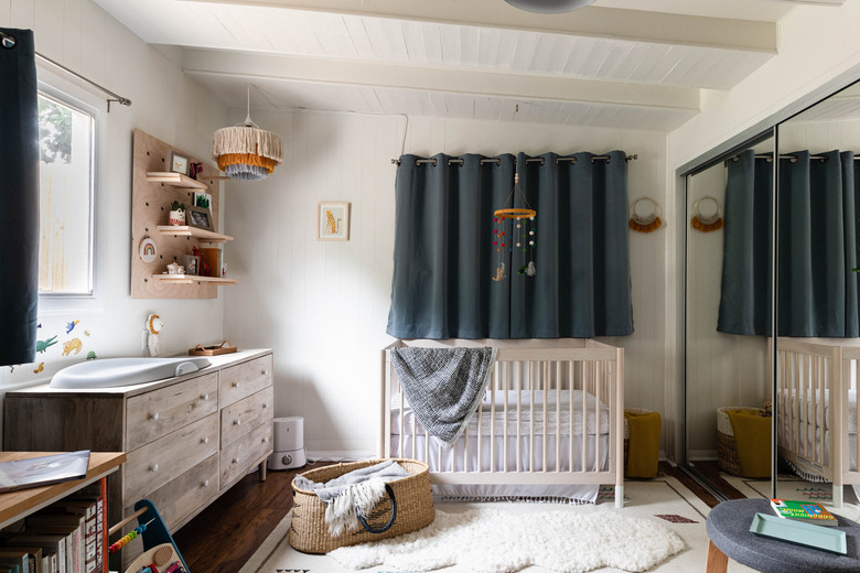 nursery space with wooden dresser